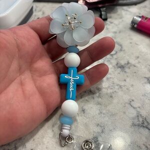 Custom beaded pens and retractable badge reels.